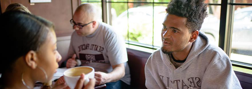 Students Talking at a Cafe