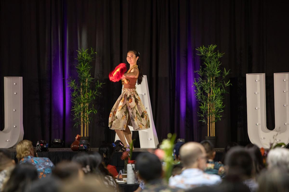 A student dances on stage